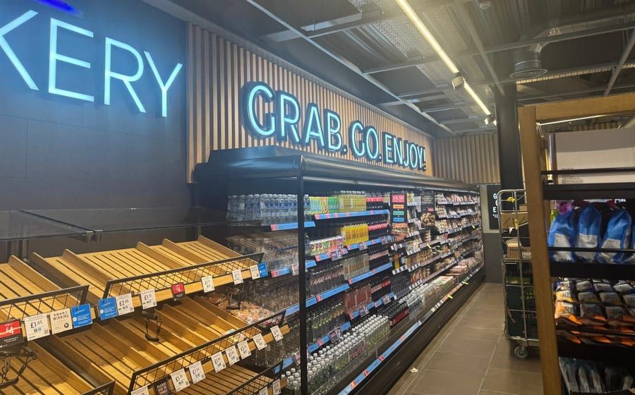 A finished in-store bakery with exposed, coordinated ceiling services.