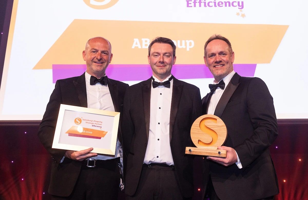 The AB Group team on stage collecting the Sainsbury's Property Strategic Partner award for Efficiency.