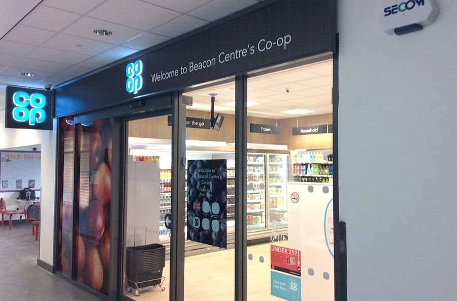 The Co-op shopfront at the Beacon Centre, with its glazed entrance and branded signage.