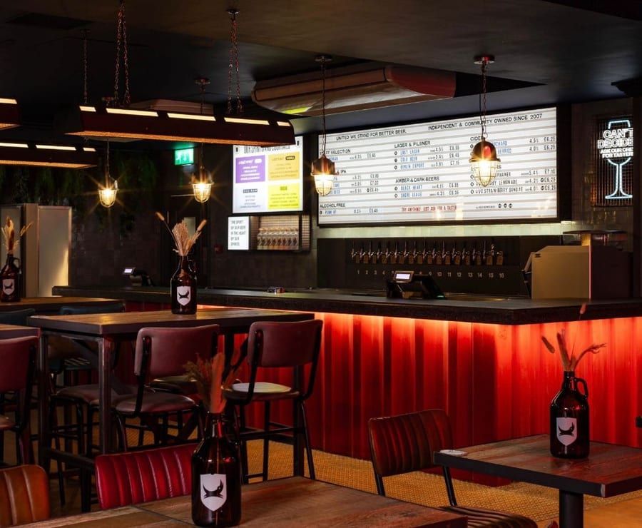 A warm, finished bar interior fitted out by AB Group.