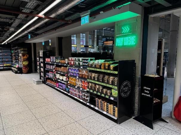 A finished grocery aisle inside the outlet.