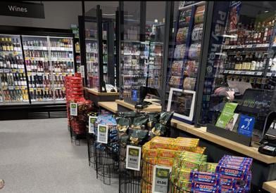 A finished grocery aisle inside the Asda Express.