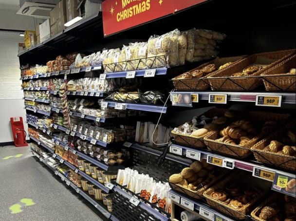 A completed grocery aisle inside the store.