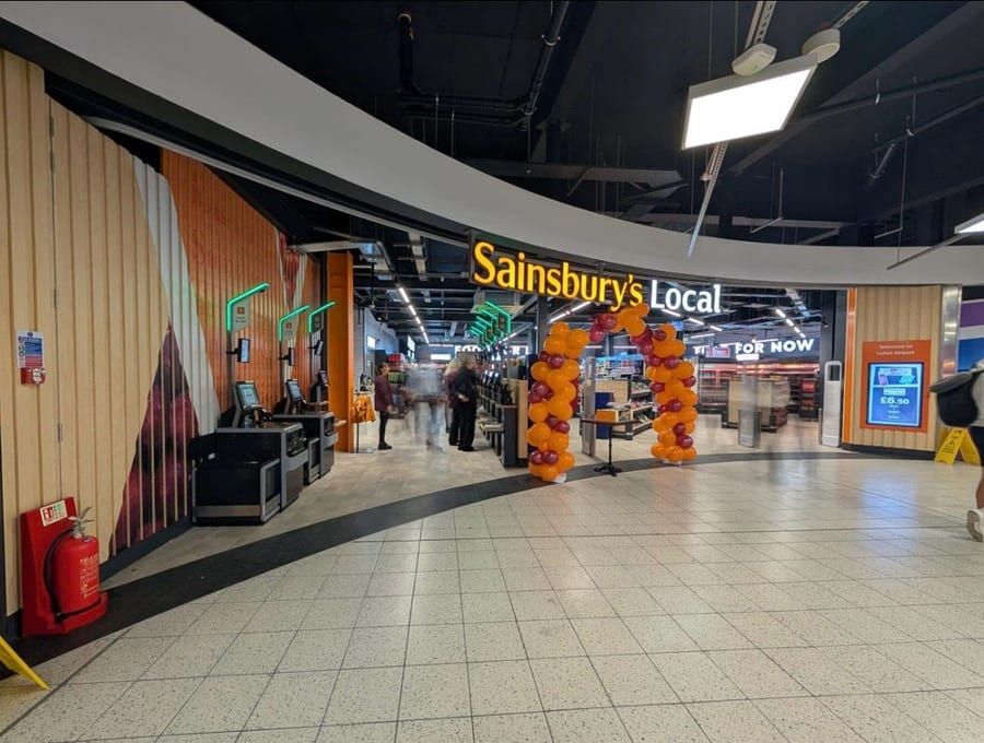 A finished convenience-store entrance on opening day.