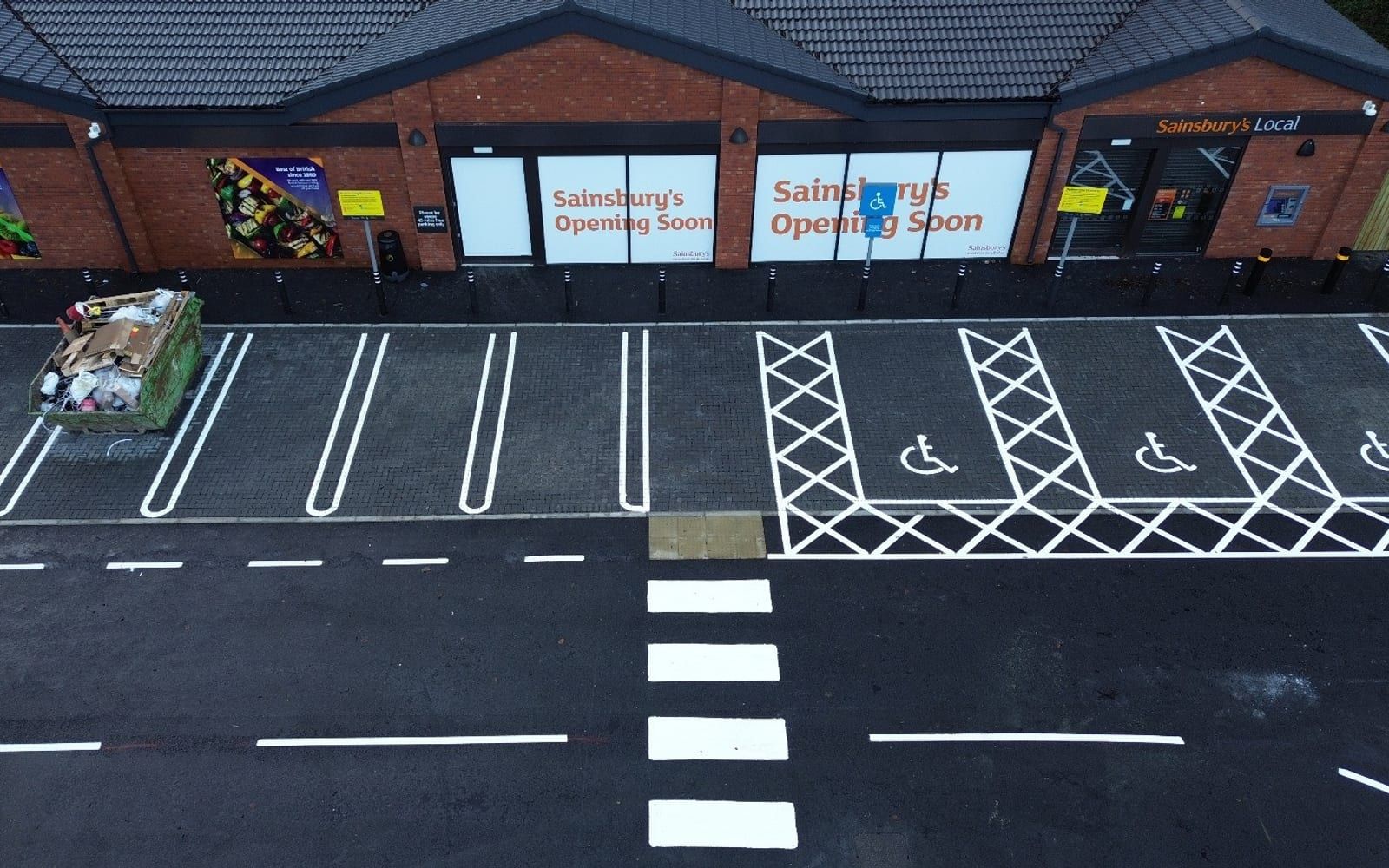 An AB Group retail unit and its finished, marked-out car park, seen from the air.