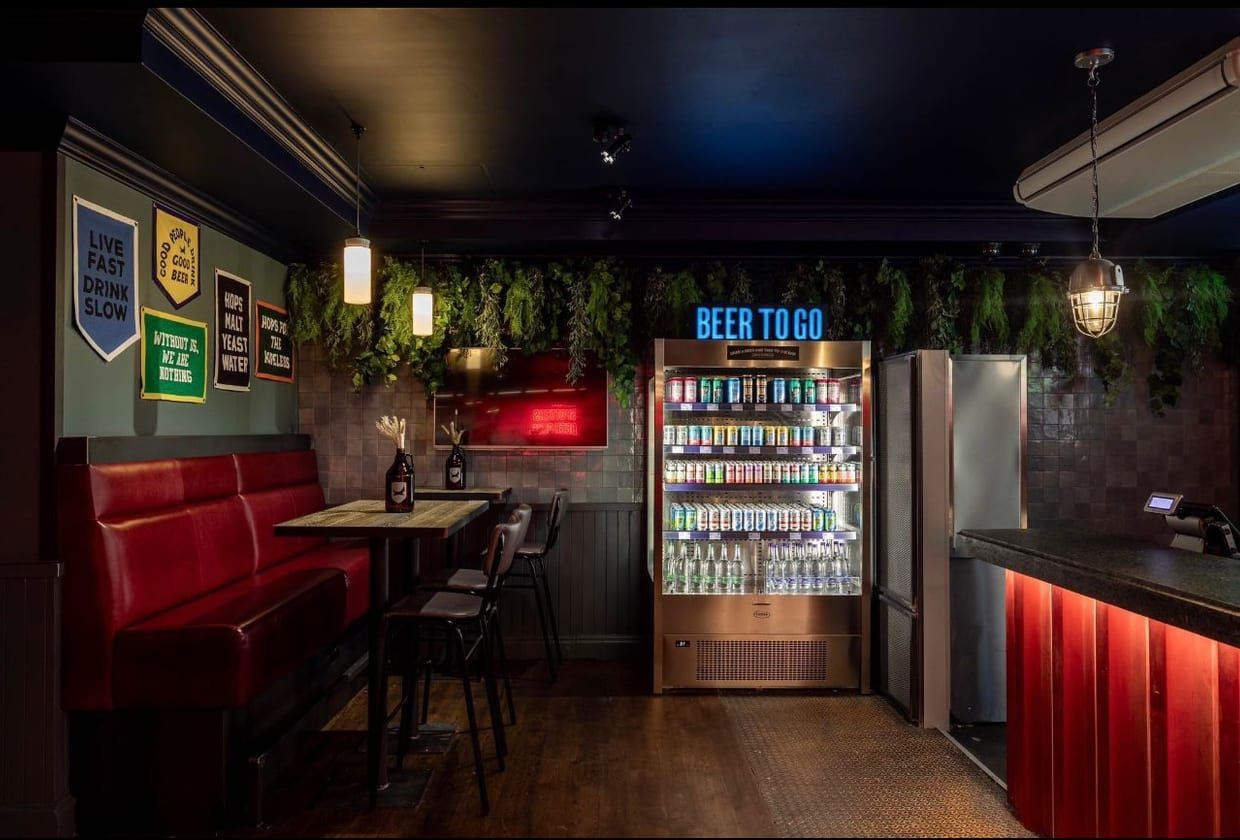 A finished bar interior handed over by AB Group, fitted and detailed.